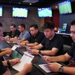 Interactive sports betting experience featuring dynamic odds and passionate bettors focusing on kèo nhà cái.