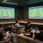 Excited patrons placing bets on mobile apps at a uu88ae sports betting lounge with live match screens